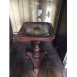 An early 19th Century mahogany wine table, circa 1835, with a woolwork inset glazed top, raised on a