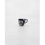 A Worcester polychrome Coffee Cup. Painted with exotic birds and insects in mirror panels on a