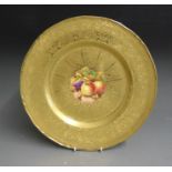 A Royal Worcester large acid etched gilded cabinet plate with a central reserve painted with fruit