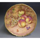 A Royal Worcester cabinet plate, painted with fruit signed Freeman, 20th Century, black mark Made in
