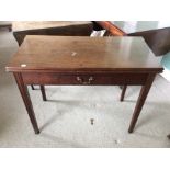 A George III mahogany fold over card table, fitted with a single drawer