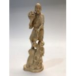 A Japanese ivory okimono of a fisherman and an infant, Meiji period, 1868-1912, signed, height 21cm