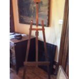A 20th Century pine adjustable floor standing picture easel, stained, 180cm high