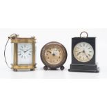 A miniature oval carriage clock, with key, face marked as Elliot & Son London, along with a