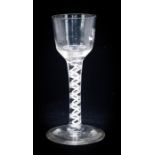 An 18th century opaque twist wine glass, the ogee bowl on a double strand helix within multi
