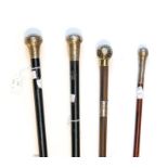 Four walking canes, 2 ebonised with silver knop handles, 2 silver knop handles are with collars