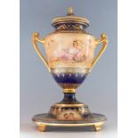 A 19th Century Vienna porcelain large twin handled covered vase on a separate circular stand, the