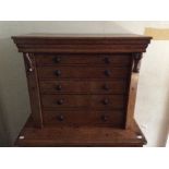 A Victorian burr walnut veneered table top Wellington chest, fitted with five drawers