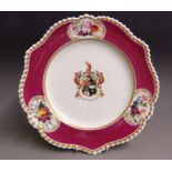 A Chamberlains Worcester armorial plate, claret ground with a gilt fluted rim with three