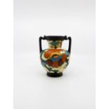 A Dutch Gouda ware twin handled vase Size; 16cm. high, 13cm. diameter including handles.
