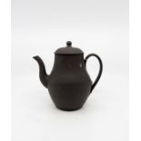 A 19th century Wedgwood black basalt pear-shape coffee pot and cover