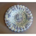 A large Dutch Delft  round fluted bowl, painted with chinoiserie figures, circa 1760, 34cm