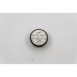 A small circular Bilston enamel patch box 'Love me and I'll love thee' approximately 2.3cm.