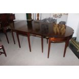 A George III mahogany D ended dining table, circa 1780, constructed of three parts, comprising drop