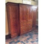 An Edwardian mahogany and satinwood inlaid wardrobe, of breakfront form, the central part in the