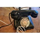 A 1930's black bakelite 200 series desk telephone, the handset dated 1935, alphabet dial, 'cheese