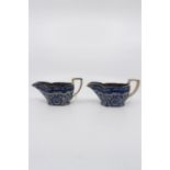 A pair of blue and white sauce boats, transfer printed with flowers and leaves, height 8cms,