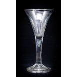 An 18th century wine glass, circa 1745, the trumpet bowl on plain stem with a single teardrop