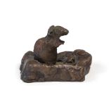 A late 19th Century French small bronze study of a mouse, on hind legs on a naturalistic plinth,