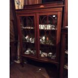 An Edwardian mahogany and satinwood inlaid display cabinet, in the manner of Thomas Sheraton, fitted