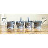 A set of 4 petwer beaker holders with shield design decoration (4)