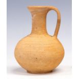 A Roman teracotta jug, bulbous body, loop handle, height 22cm