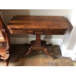 An early 19th Century brass inlaid card table, circa 1860, pedestal base, standing on sabre legs,