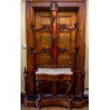Victorian carved mahogany hall stand, in the Rococo Revival style, the back with four arms, marble