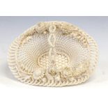 A Belleek first period ropework openwork basket, 1863-1891, of oval form with a simulated branch