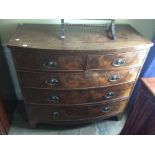An early Century mahogany bow fronted chest of drawers, fitted with two short over three long