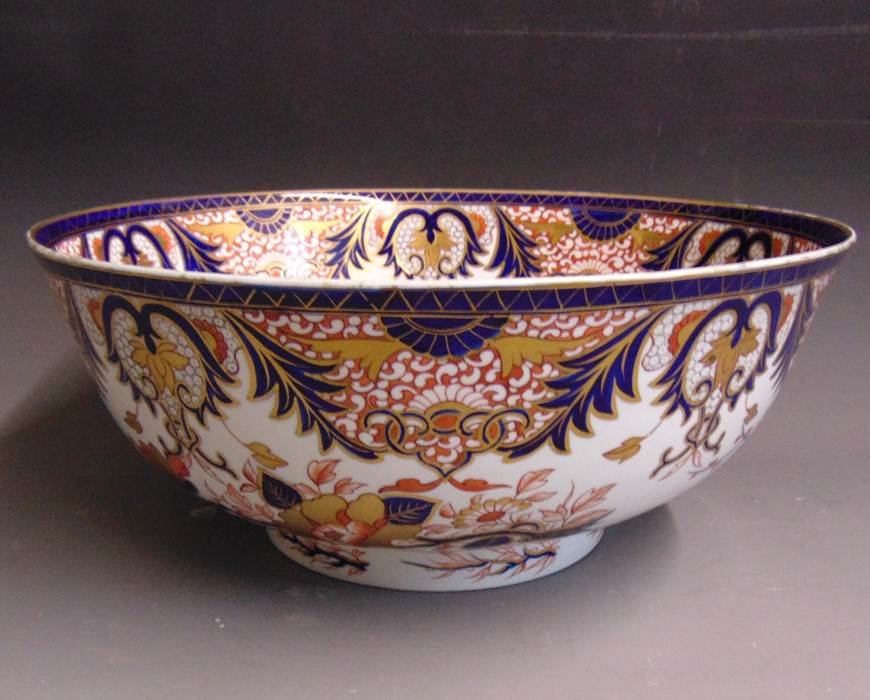 A large Derby punch bowl, decorated in the imari palette, circa 1820-25, standard red mark, 36.6cm