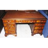 A Waring and Gillow mahogany leather inset twin pedestal writing desk, the top with a long central