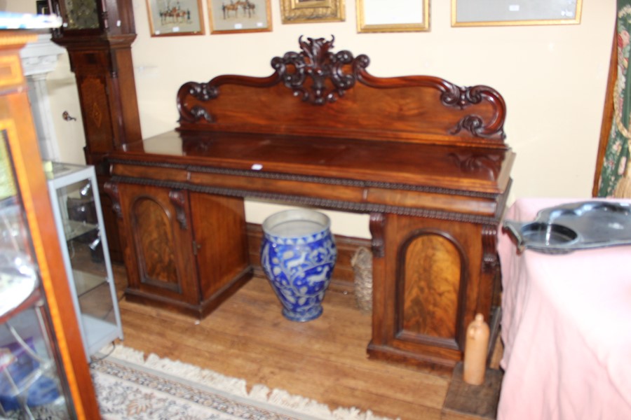 A Victorian mahogany sideboard, with superstructure, three frieze drawers, pedestal cupboards below