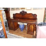 A Victorian mahogany sideboard, with superstructure, three frieze drawers, pedestal cupboards below