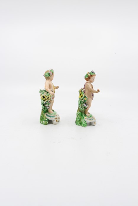 A pair of Derby cherubs, standing before bocage holding a basket, circa 1790, height 12cm (2) - Image 4 of 4