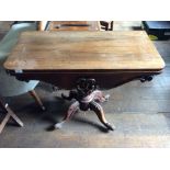 A Victorian rosewood fold-over card table, raised on a pedestal support, 73cm high, 91cm wide,
