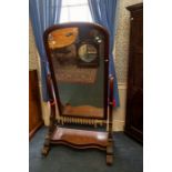 A large mid Victorian mahogany cheval mirror.