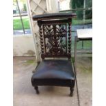 Masonic interest a mid Victorian oak carved Prie Deur chair, the carved balls with Masonic