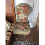 A Victorian tapastry woolwork upholstered ladies chair, circa 1870, with walnut cabriole legs, white