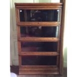 An early 20th Century four tier oak stacking bookcase, possibly by Globe Wernicke, each section