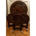 A set of 4 carved Chinese design occasional tables, 1 larger and 3 matching smaller tables. (4)