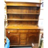 A George III oak dresser, circa 1770, the original plate rack with a moulded projecting cornice over