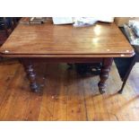 A William IV mahogany dining table with two additional leaves