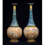 Pair of Doulton onion shaped vases with slender necks and fluted rim. Detailed  decoration to
