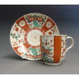 A Worcester fluted polychrome coffee cup and saucer decorated with ‘The Scarlet Japan' pattern,