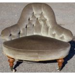 A Victorian deep buttoned back conversation chair, having a deep buttoned back