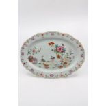 A Chinese famille rose platter, oval form, with ogee rim, Qianlong, geese in garden landscape,