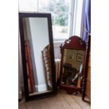 A full length mirror with carved wooden frame along with a further wall hanging mirror (2)