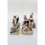 A Staffordshire flatback figure of Uncle Tom and Eva circa 1880 along with a flatback figure of