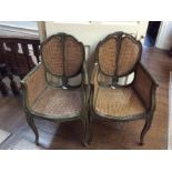 A pair of late 19th Century French double canework Bergere chairs, with canework backs, seats and